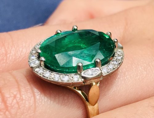 Classic emerald and diamond cluster ring