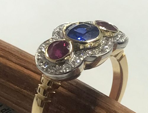 Sapphire, ruby and diamond halo ring